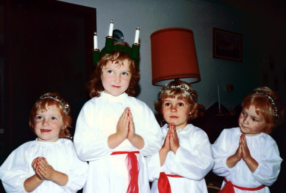 Me in the crown celebrating Lucia with my sisters and childhood friend, 5 years old.